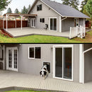 St. Bernard using a PlexiDor wall mount dog door on a gray house exterior